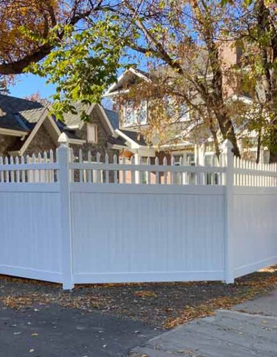 Scalloped Picket Top Vinyl Fence on a fall day